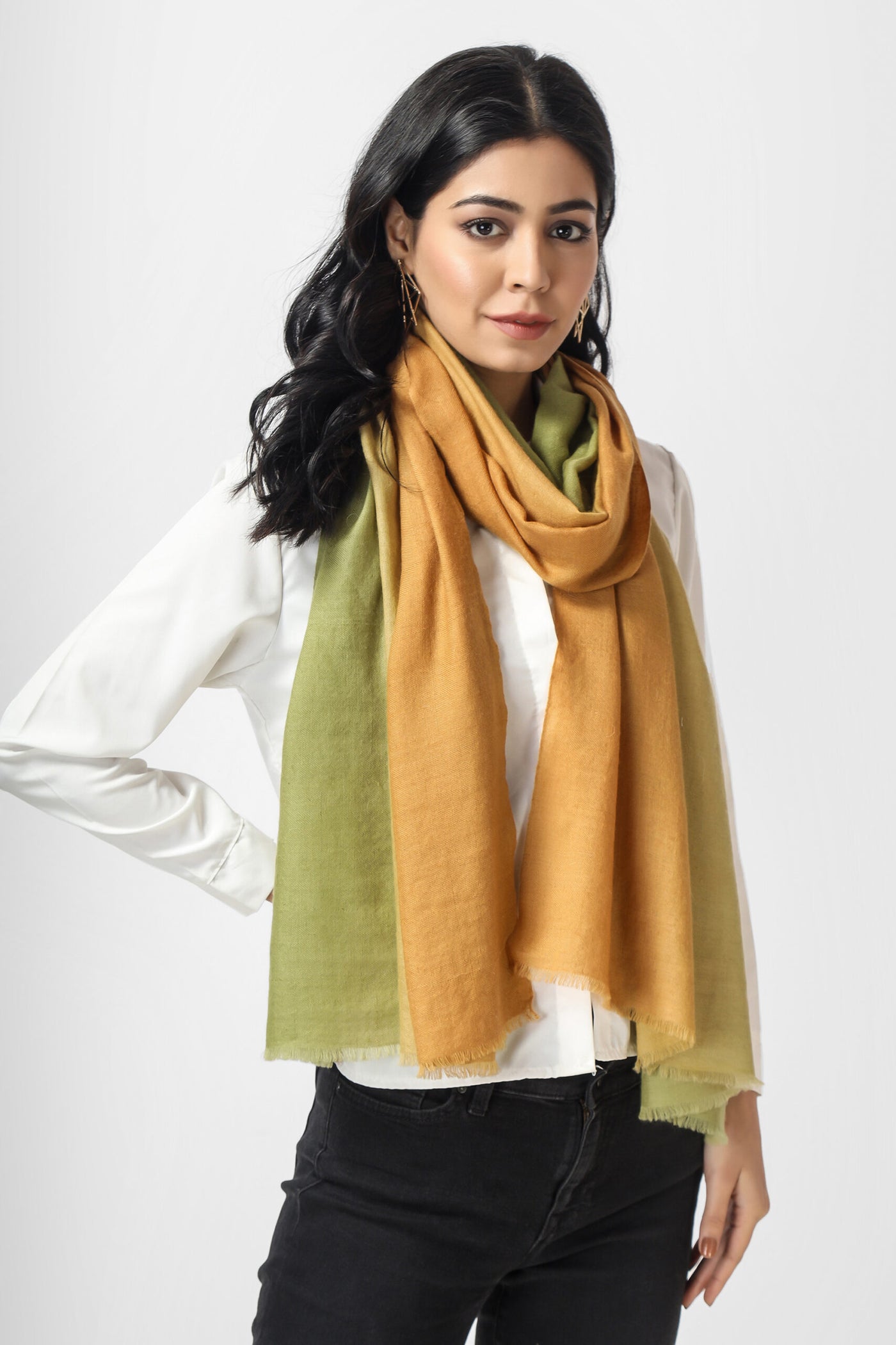 This ombre Pashmina stole Wrap is made of Pashmina fibres in lovely shades of olive green and light orange that would go well with any attire you choose to wear.  Wrap yourself in one of these stunning, genuine, ombre pashminas to set your look apart from the herd.