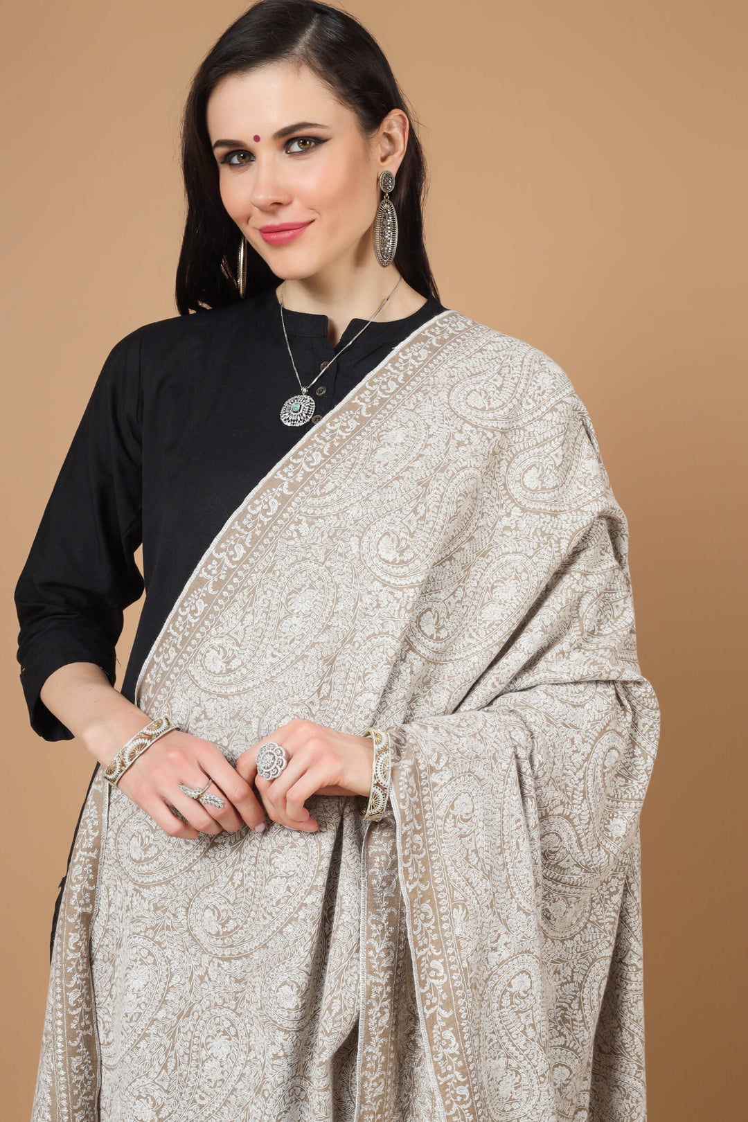  the garment of praise, a versatile piece of art with alluring Sozni embroidery. This natural (khudrang) Pure Pashmina Shawl with white Sozni Jama Hand-Embroidery