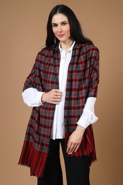 The Maroon Check Designer Pashmina Stole is a luxurious and versatile accessory made from high-quality pashmina wool. Its elegant check design adds sophistication to any outfit. 