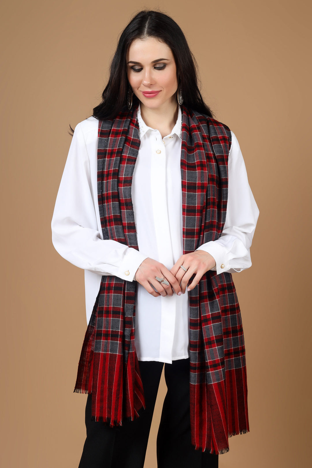 Designer Pashmina Stole The Maroon Check Designer Pashmina Stole is a luxurious and versatile accessory made from high-quality pashmina wool. Its elegant check design adds sophistication to any outfit. 