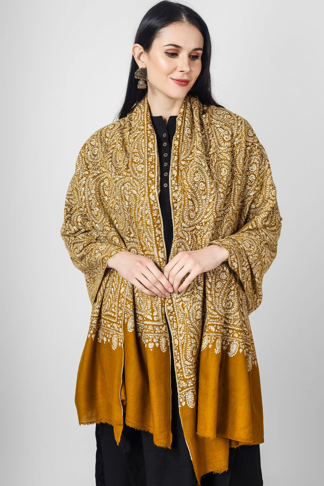 A beautiful bright Mustard (golden)colored Pashmina jama  is featured by intricate Sozni across its surface called the Jama pattern . 