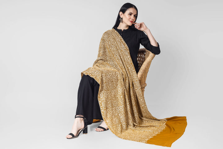 A beautiful bright Mustard (golden)colored Pashmina jama  is featured by intricate Sozni across its surface called the Jama pattern . 