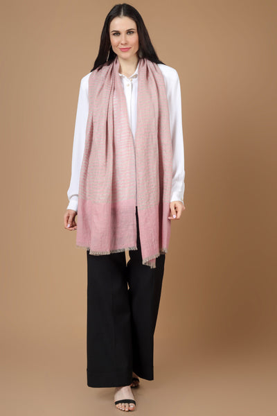 The stole is hand woven in a light pink with stripes design to complement your winter outfits in the most stylish manner. It has bright colours, a fine texture, and a comforting warm touch of the beloved blue Pashmina. enjoy the comfort of real pashmina stoles on your shoulder 