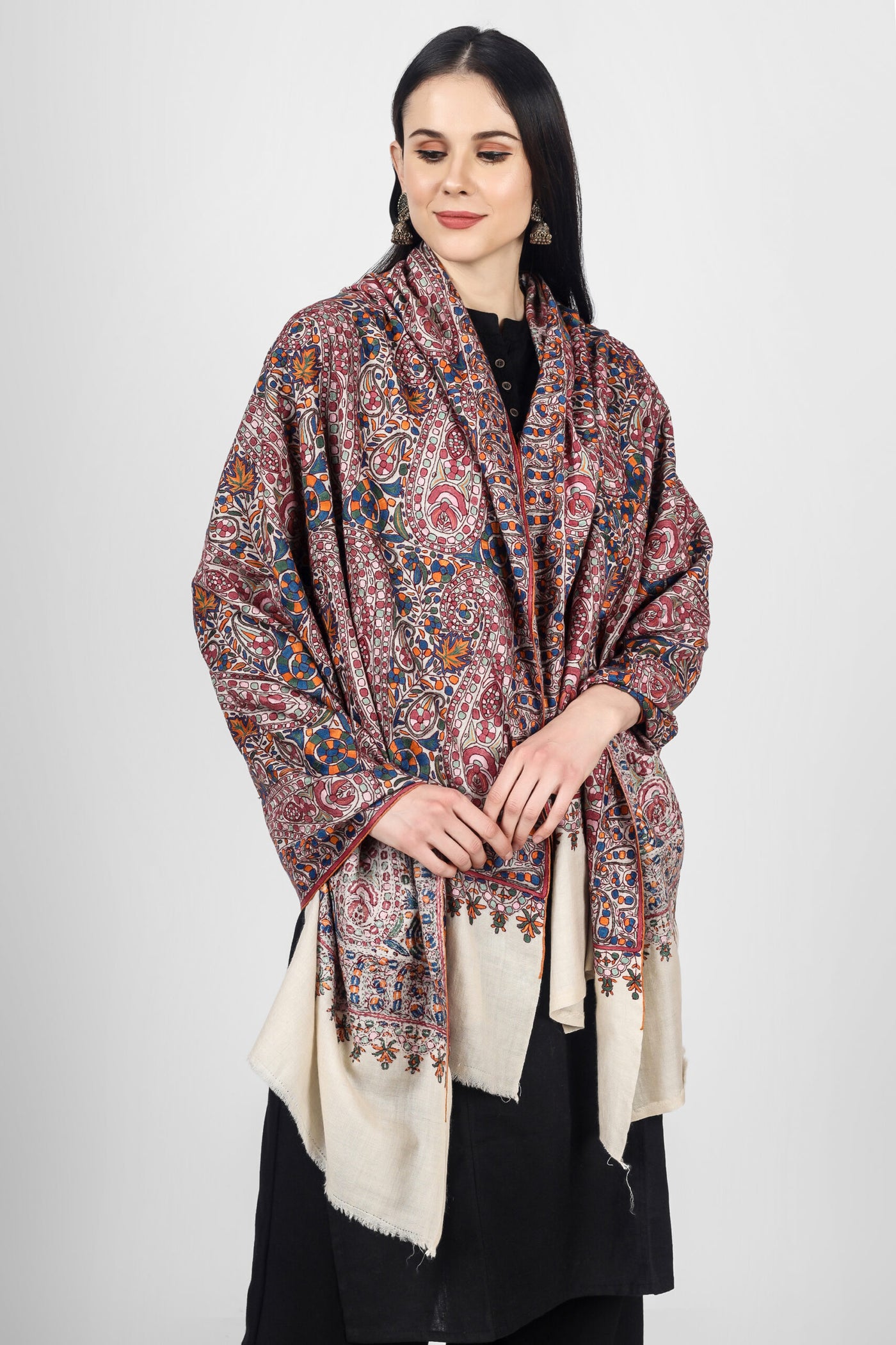 This White  Pure Pashmina Shawl With Papier Mache Jama Hand Embroidery inspired by paisley and floral motifs will embrace your beauty in every way.