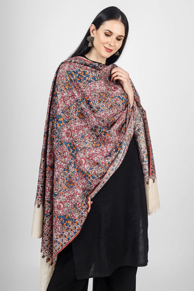 This White  Pure Pashmina Shawl With Papier Mache Jama Hand Embroidery inspired by paisley and floral motifs will embrace your beauty in every way.