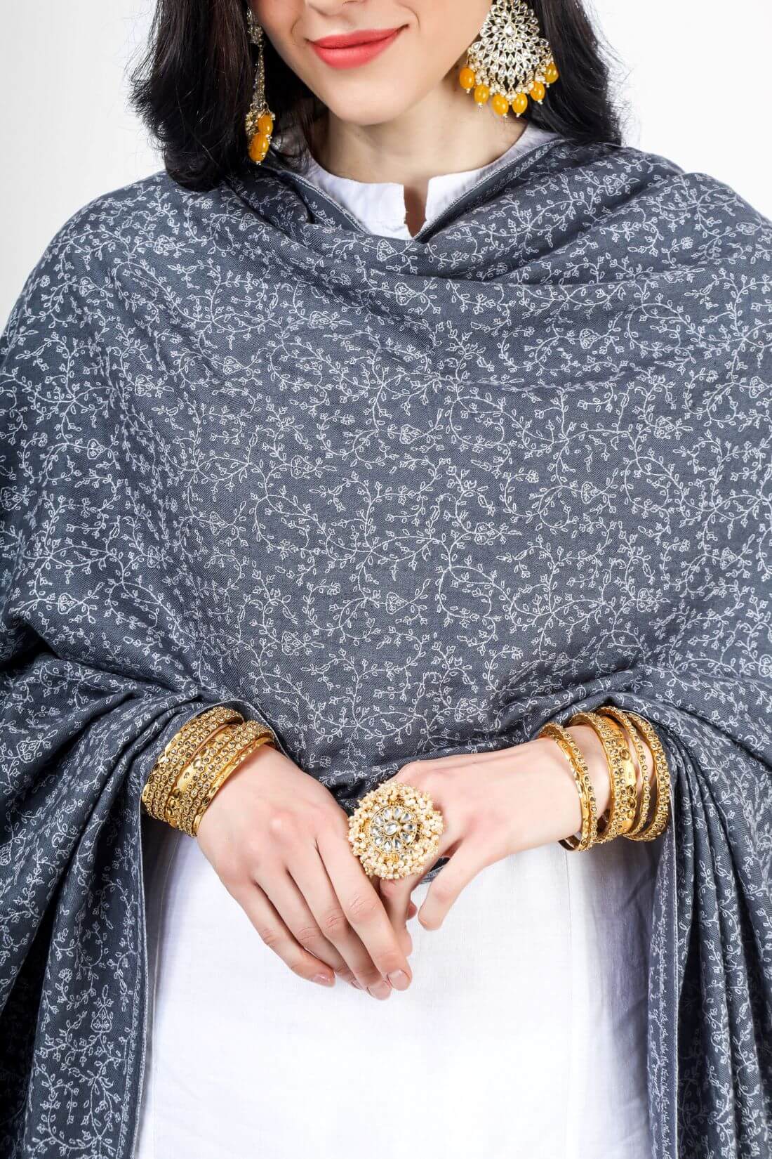  This Gray pashmina shawl Jaldaar can be draped over the shoulders to add a touch of elegance to any outfit. It can also be worn as a hijab or headscarf for a modest and stylish look. The intricate embroidery and unique pattern make this shawl a truly one-of-a-kind piece that is sure to impress.