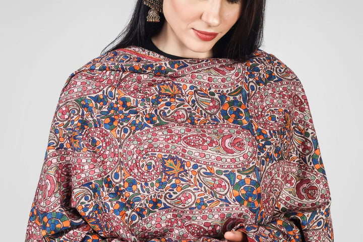 This White  Pure Pashmina Shawl With Papier Mache Jama Hand Embroidery inspired by paisley and floral motifs will embrace your beauty in every way.