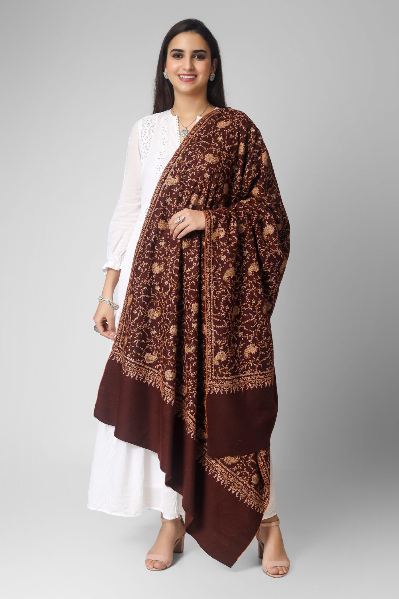 INDIAN SHAWL- The dark brown color of the shawl provides a rich and sophisticated background for the multicolor embroidery, which features intricate patterns and designs inspired by traditional Indian and Persian motifs. The embroidery is done by skilled artisans using fine threads and needles.