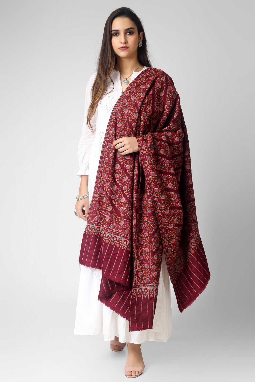  A passionate and ravishing wine color Pashmina Shawl in combination with the legendary paper mache Sozni Embroidery in intricate Jaldaar khatras. 