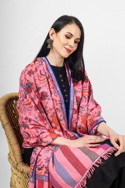 The blooming almond blossoms direct from the alcoves and gardens of Kashmir are directly designed on a pink Pashmina Shawl in Kani pattern.