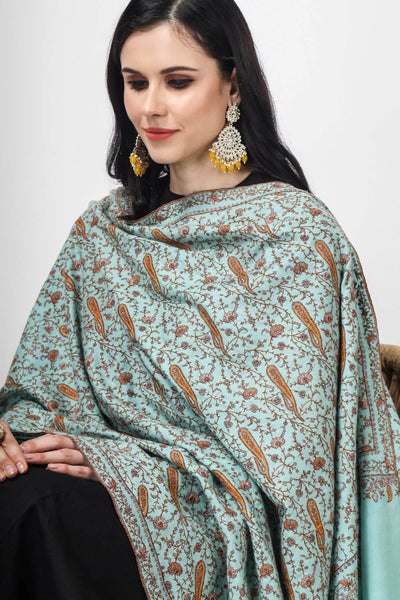 PASHMINA SHAWL  Indulge in luxury with this exquisite turquoise handmade Pashmina Shawl adorned with intricate Sozni embroidery in a Jaldaar pattern, crafted from the finest natural pashmina wool This shawl features charming Sozni silk threads in vivid floral vines that form symmetrical patterns,