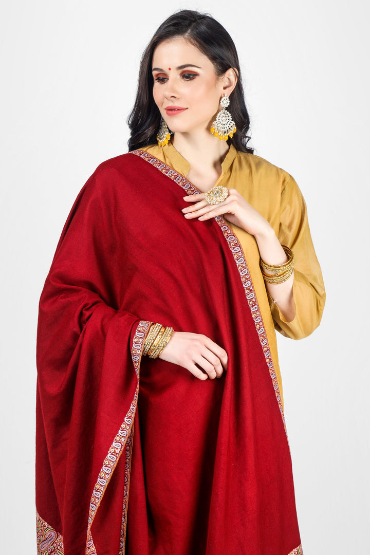 This is a maroon pashmina border shawl embroidered by our expert artisan In our online pashmina shop, 